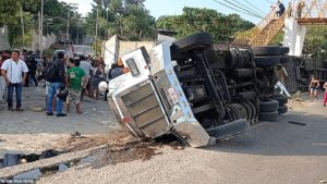At least 54 US-bound migrants died when the container truck they were in crashed in Mexico - with one official blaming the speed of the vehicle and the weight of its human cargo for the tragedy.  Dozens of bodies arranged in rows covered in white sheets were photographed laid across a roadway in the southern Mexican state of Chiapas On Thursday. At least 54 further people were wounded, 21 seriously, in the horror smash.  The deceased were believed to be Central American migrants, some from Guatemala and Honduras.  As many as 200 migrants were packed in a cargo truck used to transport perishable goods that rolled over and crashed into a pedestrian bridge over a highway, causing dozens of deaths and serious injuries.  The trailer broke open and spilled out migrants when the truck crashed on a sharp curve outside the city of Tuxtla Gutierrez in the state of Chiapas, according to video footage of the aftermath and civil protection authorities.  It is one of the worst accidents to befall migrants risking their lives to reach the United States since the 2010 massacre of 72 migrants by the Zetas drug cartel in the northern Mexican state of Tamaulipas.  'It took a bend, and because of the weight of us people inside, we all went with it,' said a shocked-looking Guatemalan man sitting at the scene in footage broadcast on social media.  'The trailer couldn't handle the weight of people.' Agnesisika blog
