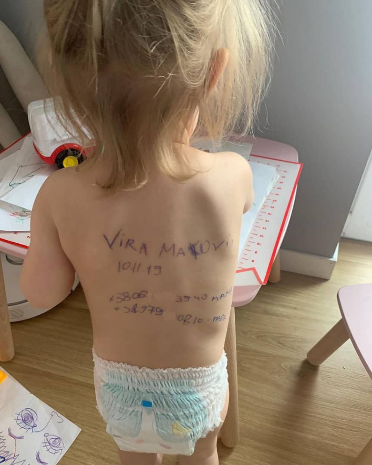 Ukraine Mother Writes Vital Information On Her Little Daughter's Back In Fears Of Being Killed (Photos).