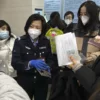 China to resume issuing passports, visas as virus curbs ease