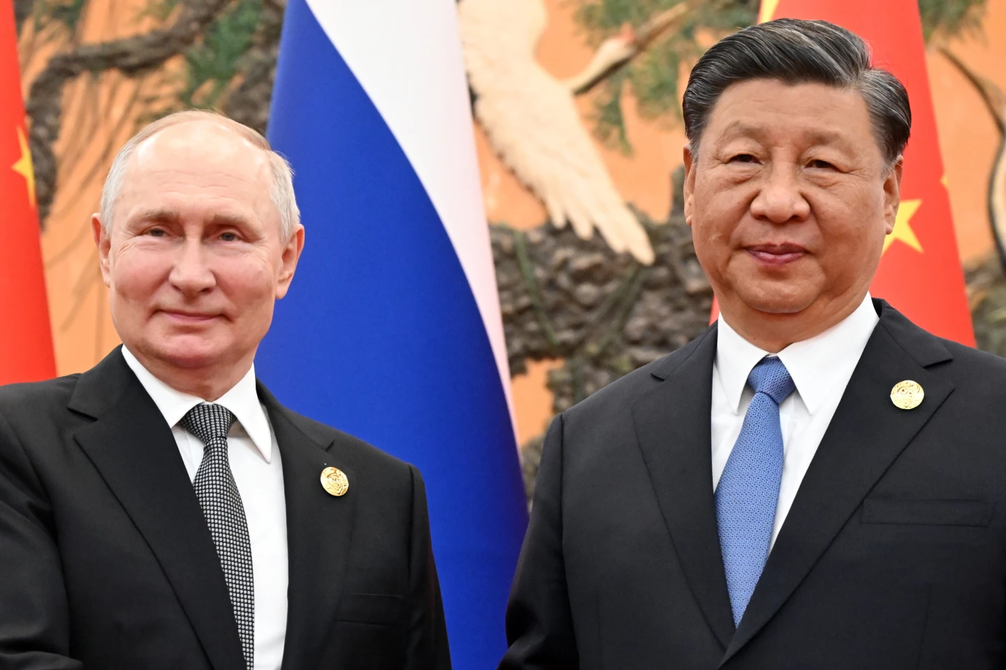 Russian President Putin and Chinese leader Xi meet in Beijing and call for close policy coordination